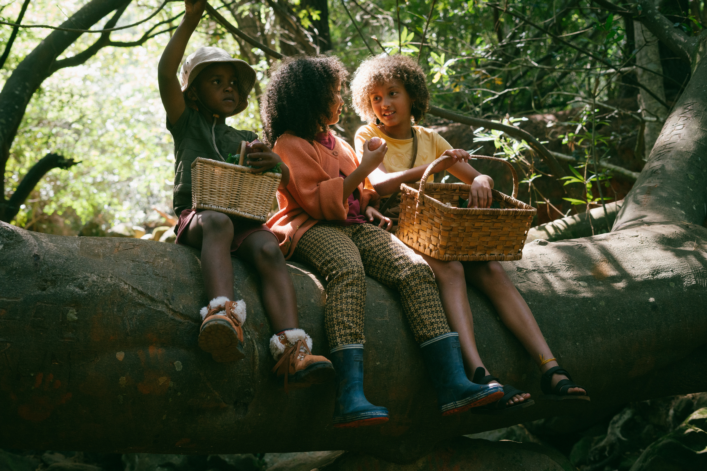 Kids with Wicker Baskets Foraging in the Forest